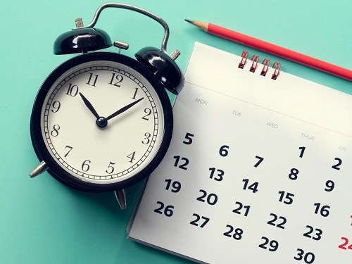 Clock and calendar against blue background